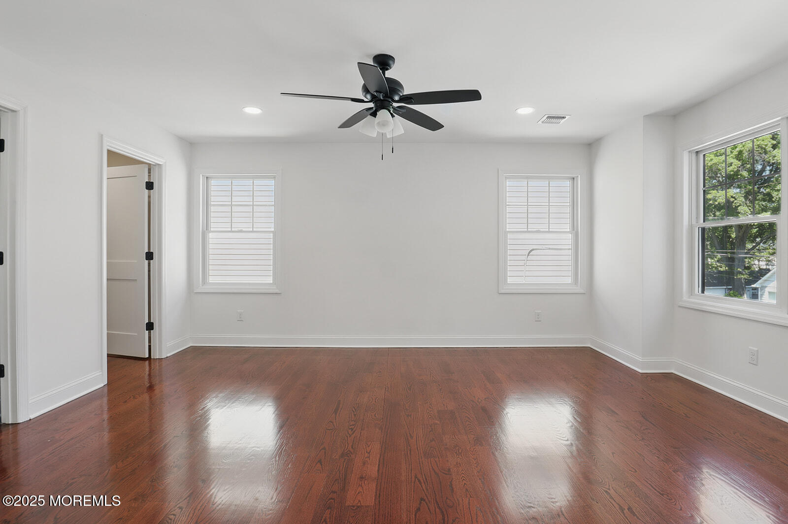 18 Neptune Place North Middletown, NJ 07748 - Photo 14 of 49 wooden floor in an empty room with a window
