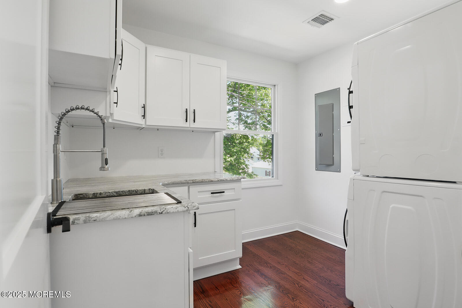 18 Neptune Place North Middletown, NJ 07748 - Photo 28 of 49 a view of kitchen with a refrigerator cabinets and wooden floor