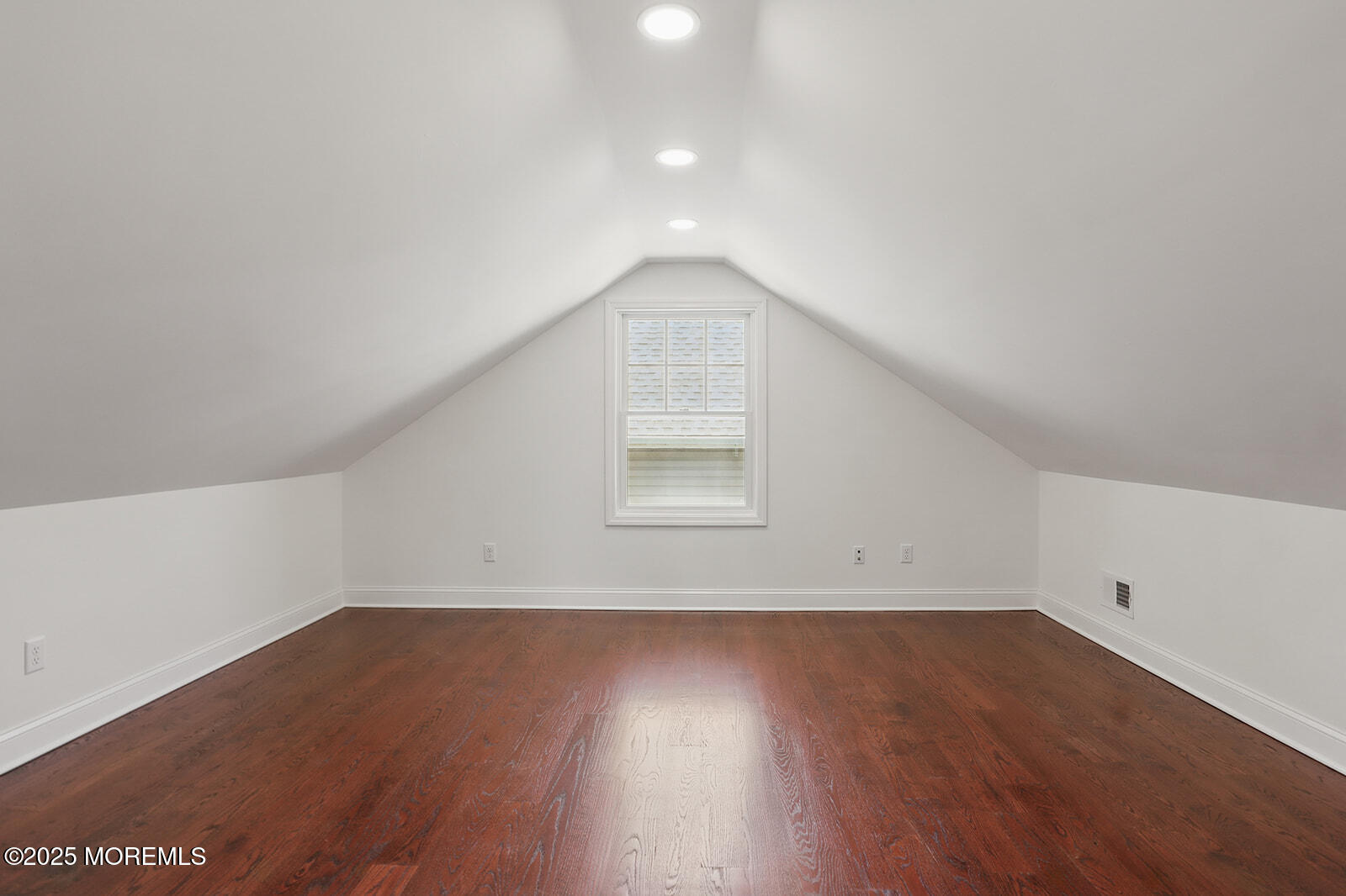 18 Neptune Place North Middletown, NJ 07748 - Photo 31 of 49 a view of an empty room with wooden floor and a window