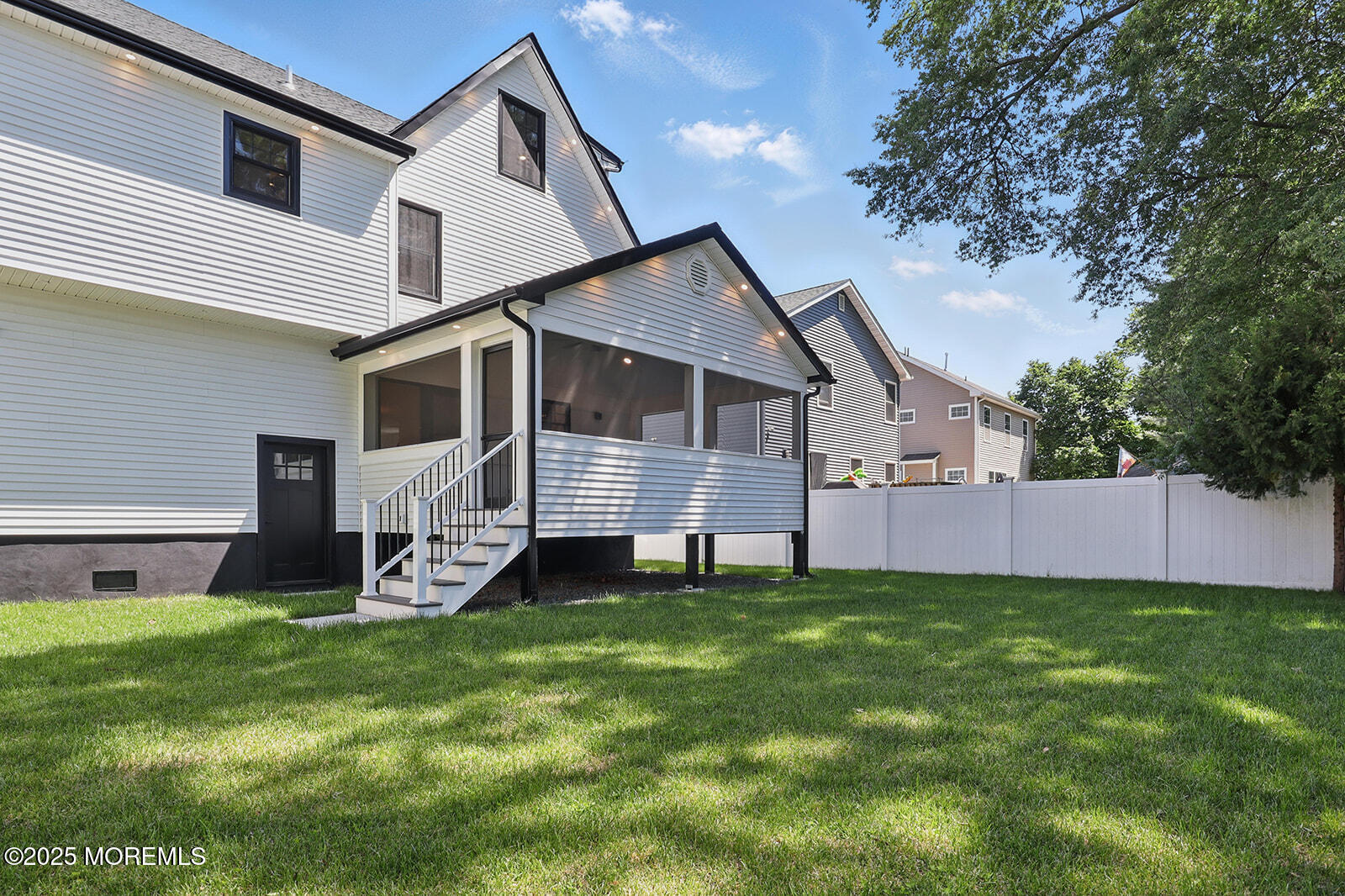 18 Neptune Place North Middletown, NJ 07748 - Photo 35 of 49 a front view of house with yard and green space