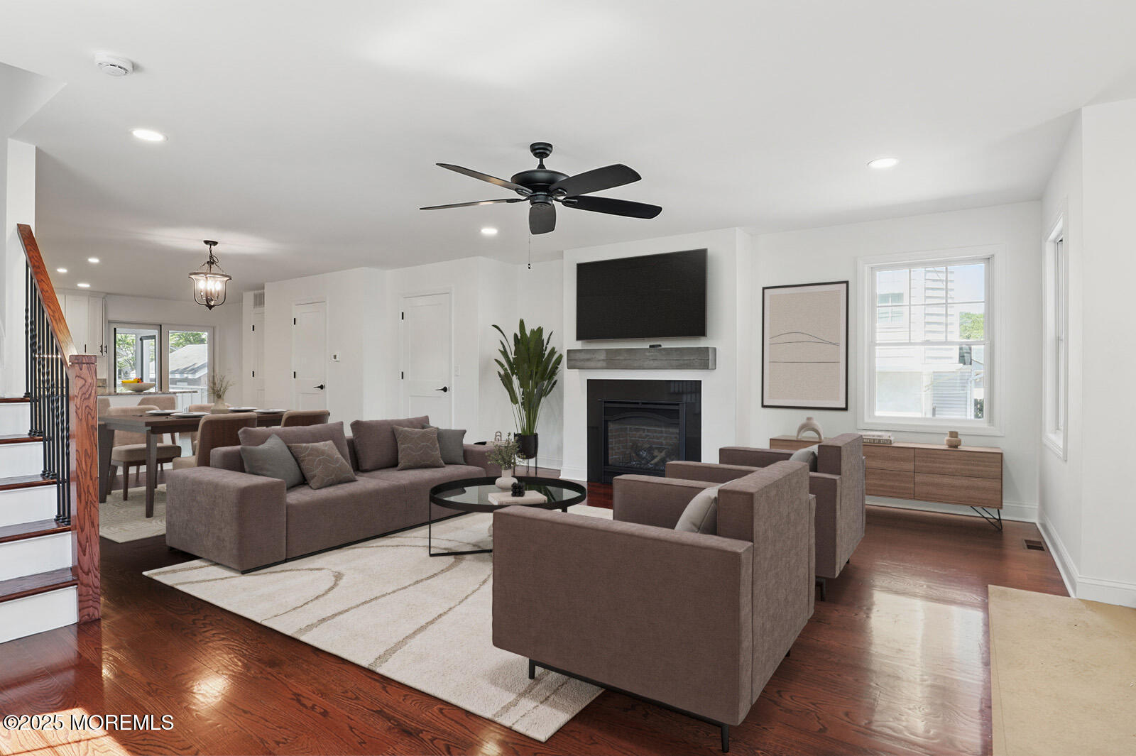 18 Neptune Place North Middletown, NJ 07748 - Photo 8 of 49 a living room with furniture a fireplace and a flat screen tv