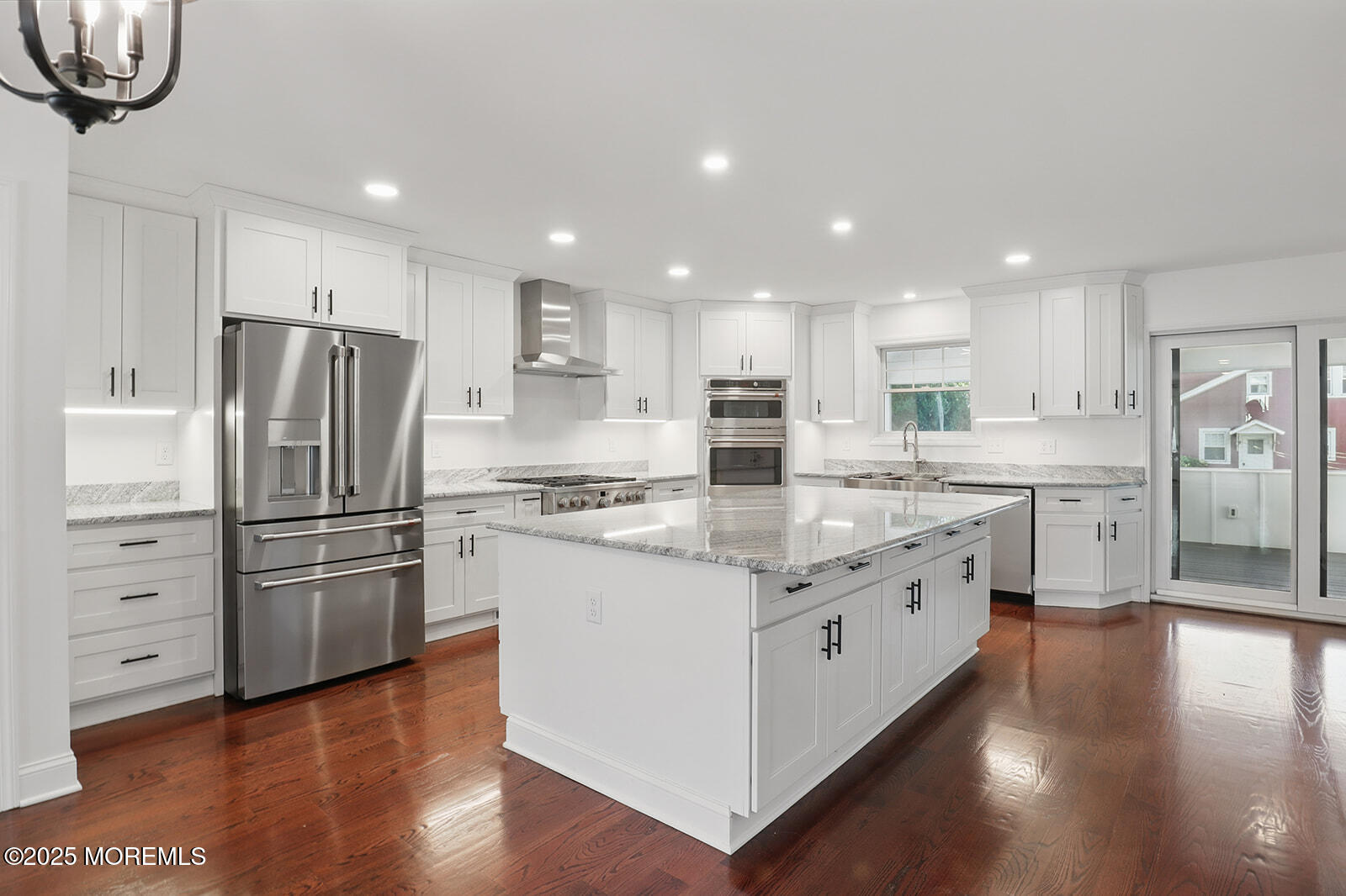 18 Neptune Place North Middletown, NJ 07748 - Photo 9 of 49 a kitchen with stainless steel appliances granite countertop a refrigerator sink and white cabinets