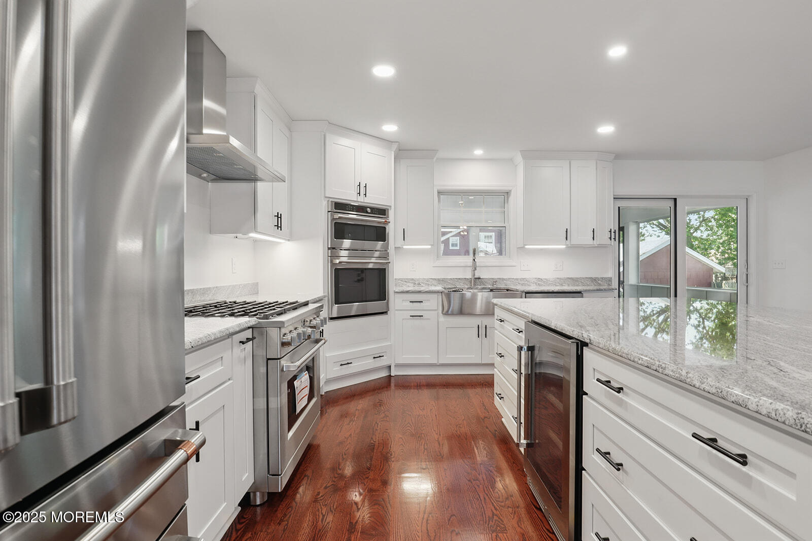 18 Neptune Place North Middletown, NJ 07748 - Photo 10 of 49 a kitchen with stainless steel appliances white cabinets and a refrigerator