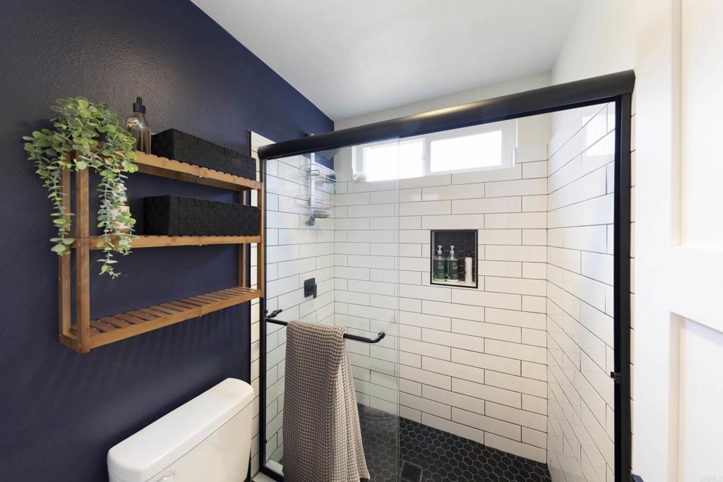 3577 Winslow Road Oceanside, CA 92056 - Photo 25 of 53 a bathroom with a toilet a sink and mirror