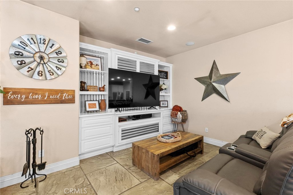 7381 Cygnet Road Phelan, CA 92371 - Photo 14 of 64 a living room with furniture and a flat screen tv