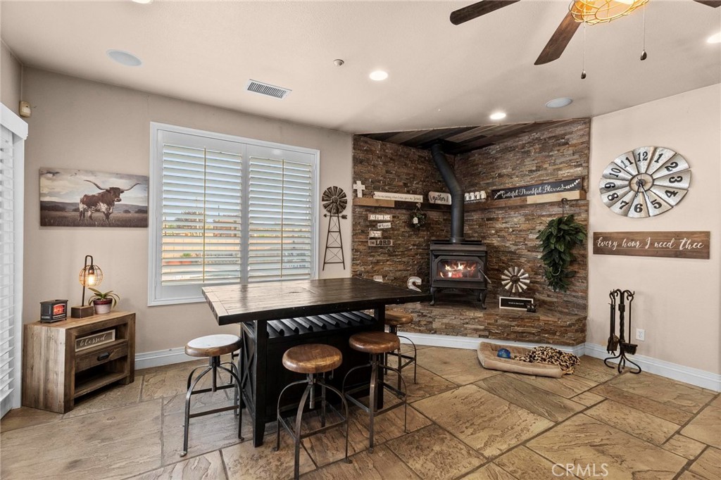 7381 Cygnet Road Phelan, CA 92371 - Photo 15 of 64 a kitchen with stainless steel appliances granite countertop a stove and a refrigerator