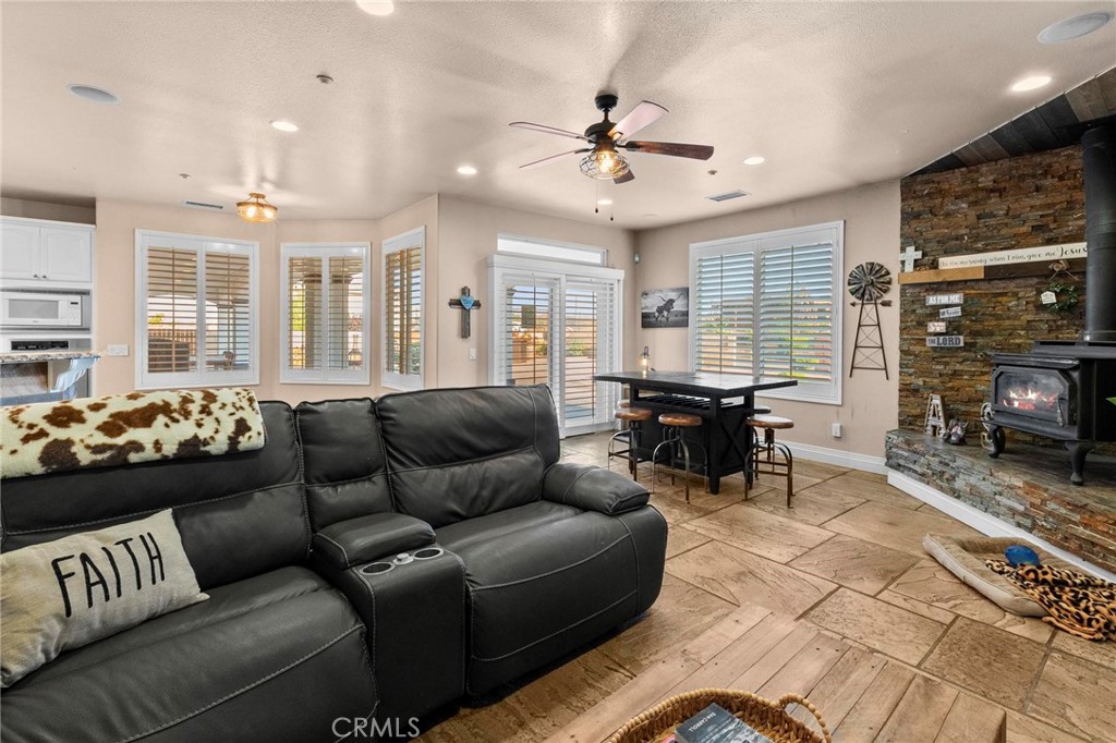 7381 Cygnet Road Phelan, CA 92371 - Photo 17 of 64 a living room with furniture and a flat screen tv