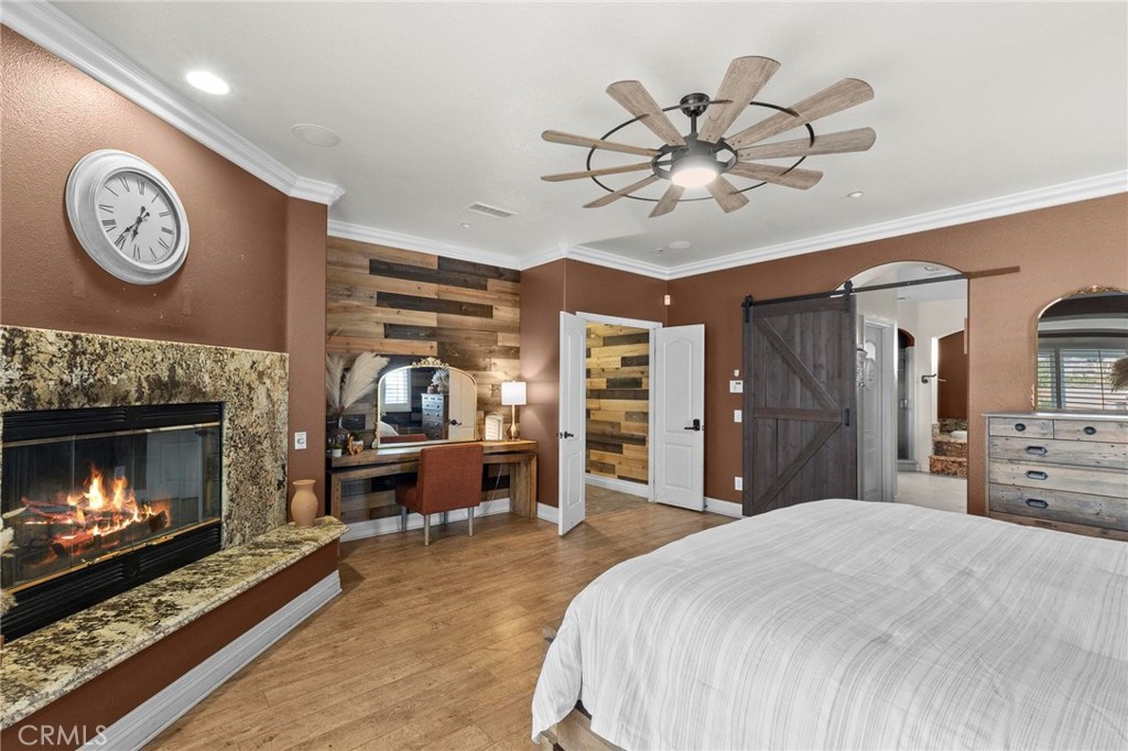 7381 Cygnet Road Phelan, CA 92371 - Photo 28 of 64 a bedroom with a bed and a fireplace