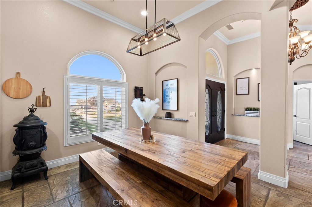 7381 Cygnet Road Phelan, CA 92371 - Photo 33 of 64 a living room with furniture a chandelier and a window