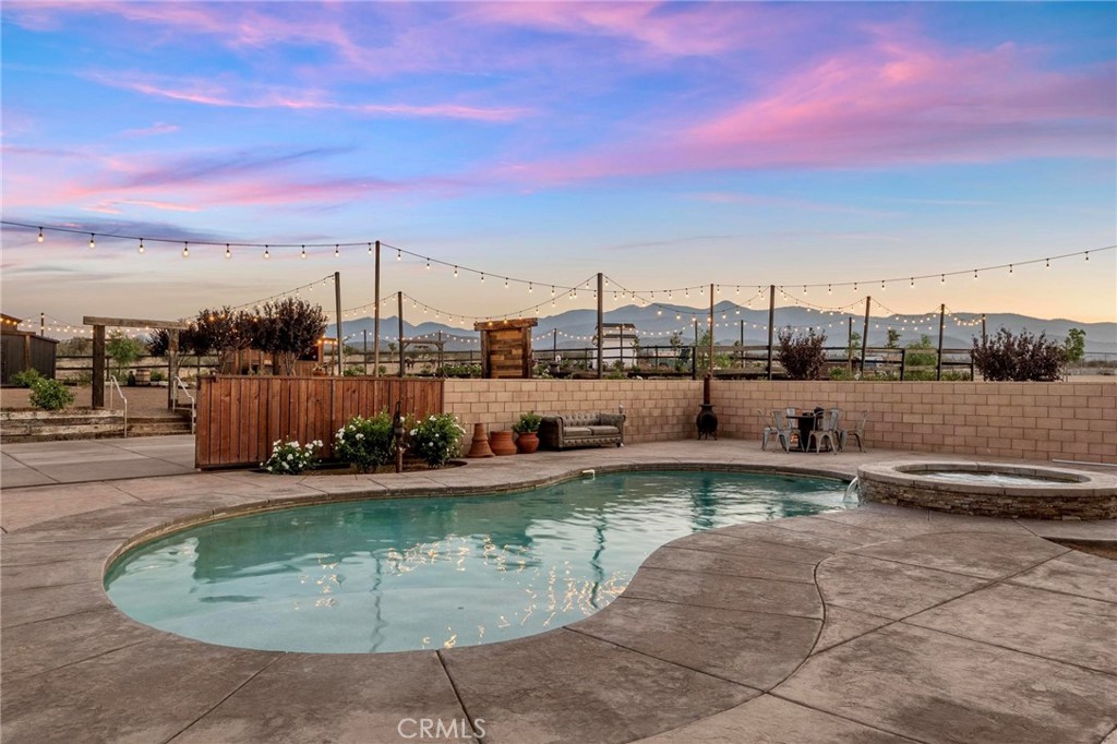 7381 Cygnet Road Phelan, CA 92371 - Photo 40 of 64 a view of a swimming pool with a lounge chairs