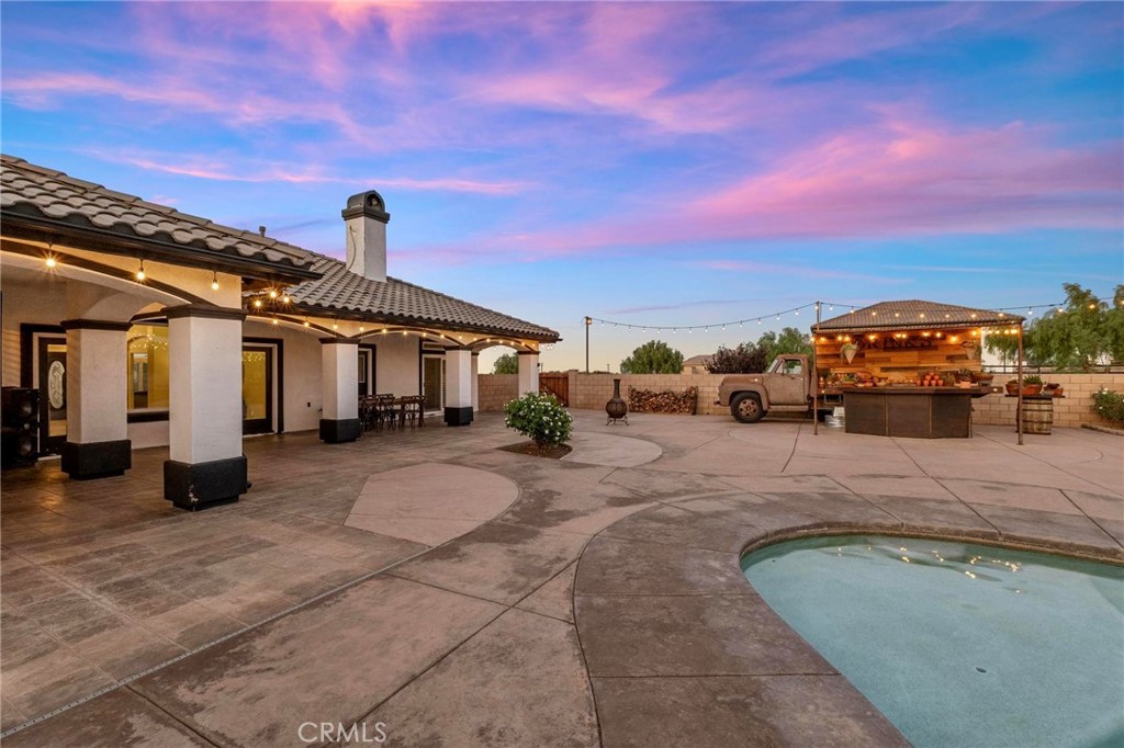7381 Cygnet Road Phelan, CA 92371 - Photo 5 of 64 a view of a terrace with a barbeque