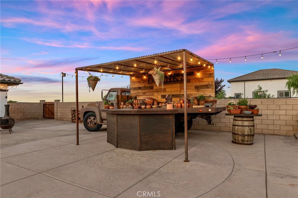 7381 Cygnet Road Phelan, CA 92371 - Photo 55 of 64 a view of a chairs and tables in the patio