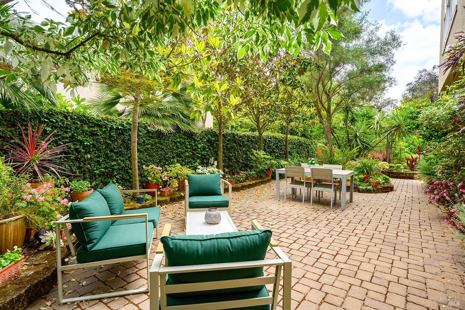 38 Maybeck Street Novato, CA 94949 - Photo 10 of 47 a view of a patio with couches and a table and chairs with garden view