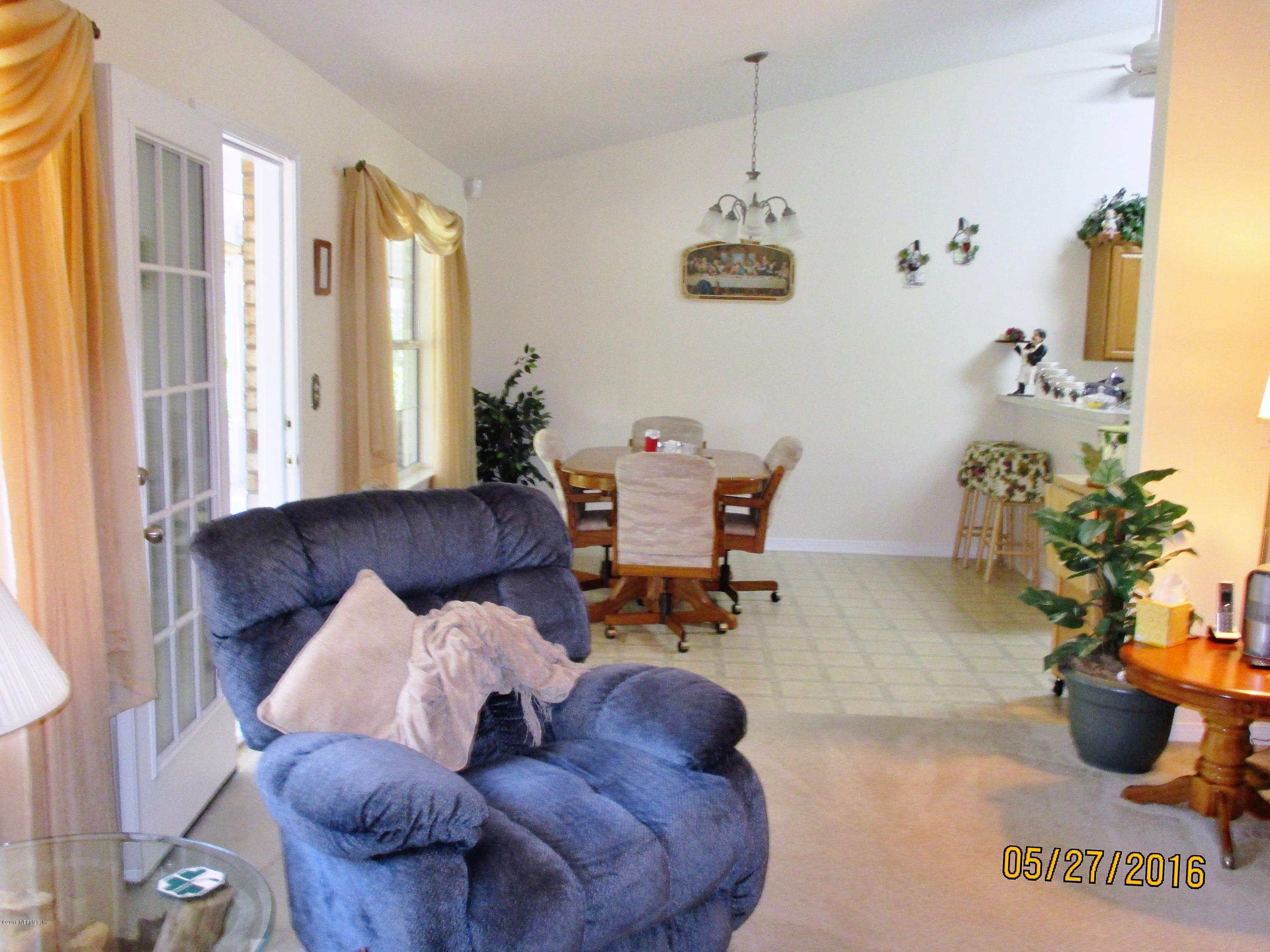 3036 Longleaf Ranch Circle Middleburg, FL 32068 - Photo 8 of 33 View from family room to breckfast room