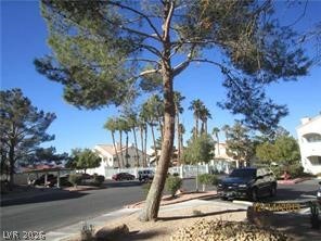 7570 West Flamingo Road, Unit 125 Las Vegas, NV 89147 - Photo 29 of 29 View of asphalt road with sidewalks and a residential view
