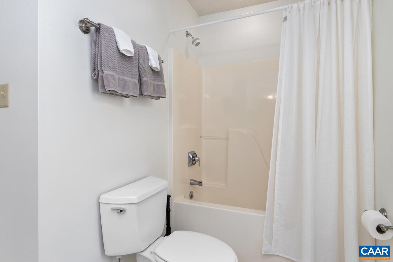 2016 Stone Rdg Wds Roseland, VA 22967 - Photo 15 of 32 a white toilet sitting next to a bath tub