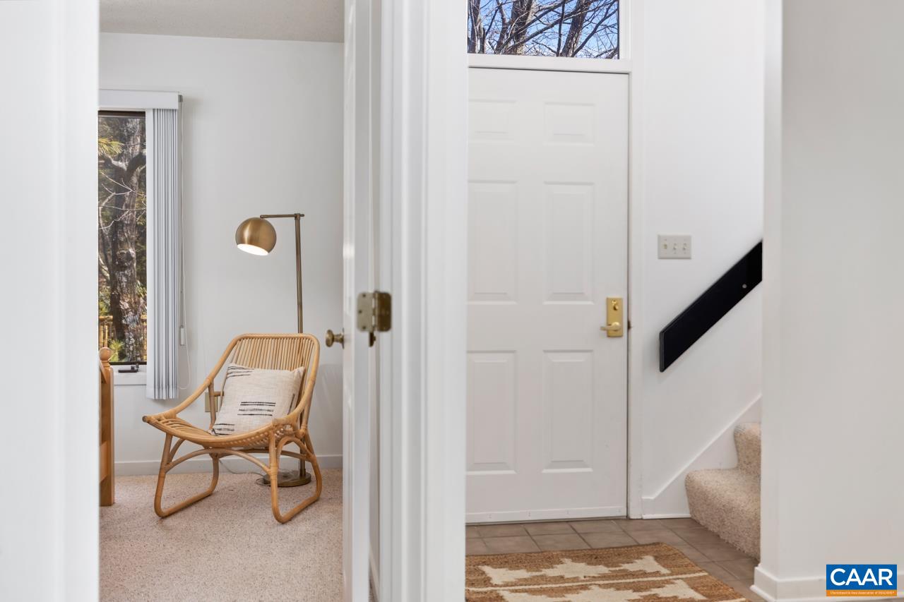 2016 Stone Rdg Wds Roseland, VA 22967 - Photo 16 of 32 a view of a hallway with couch and closet