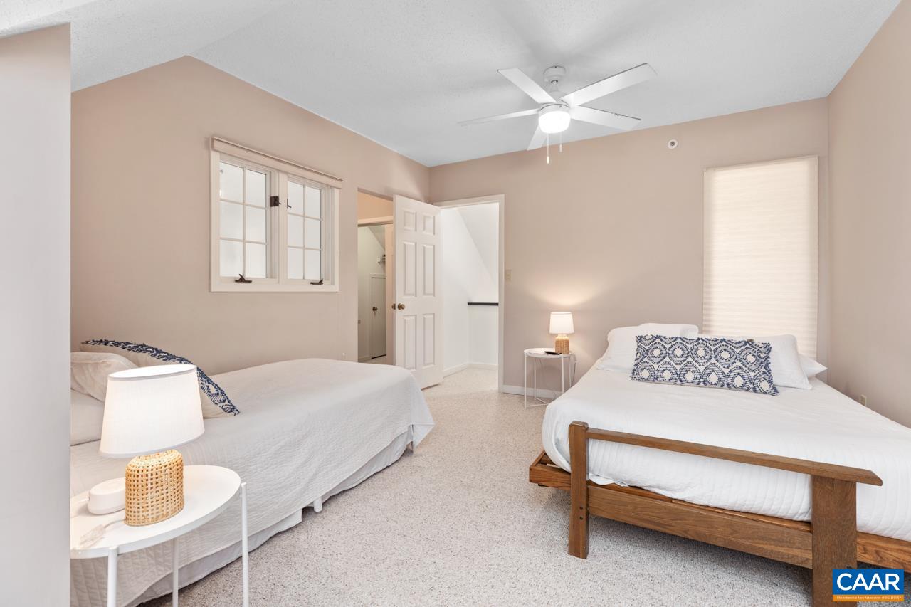 2016 Stone Rdg Wds Roseland, VA 22967 - Photo 22 of 32 a spacious bedroom with a bed and a chandelier