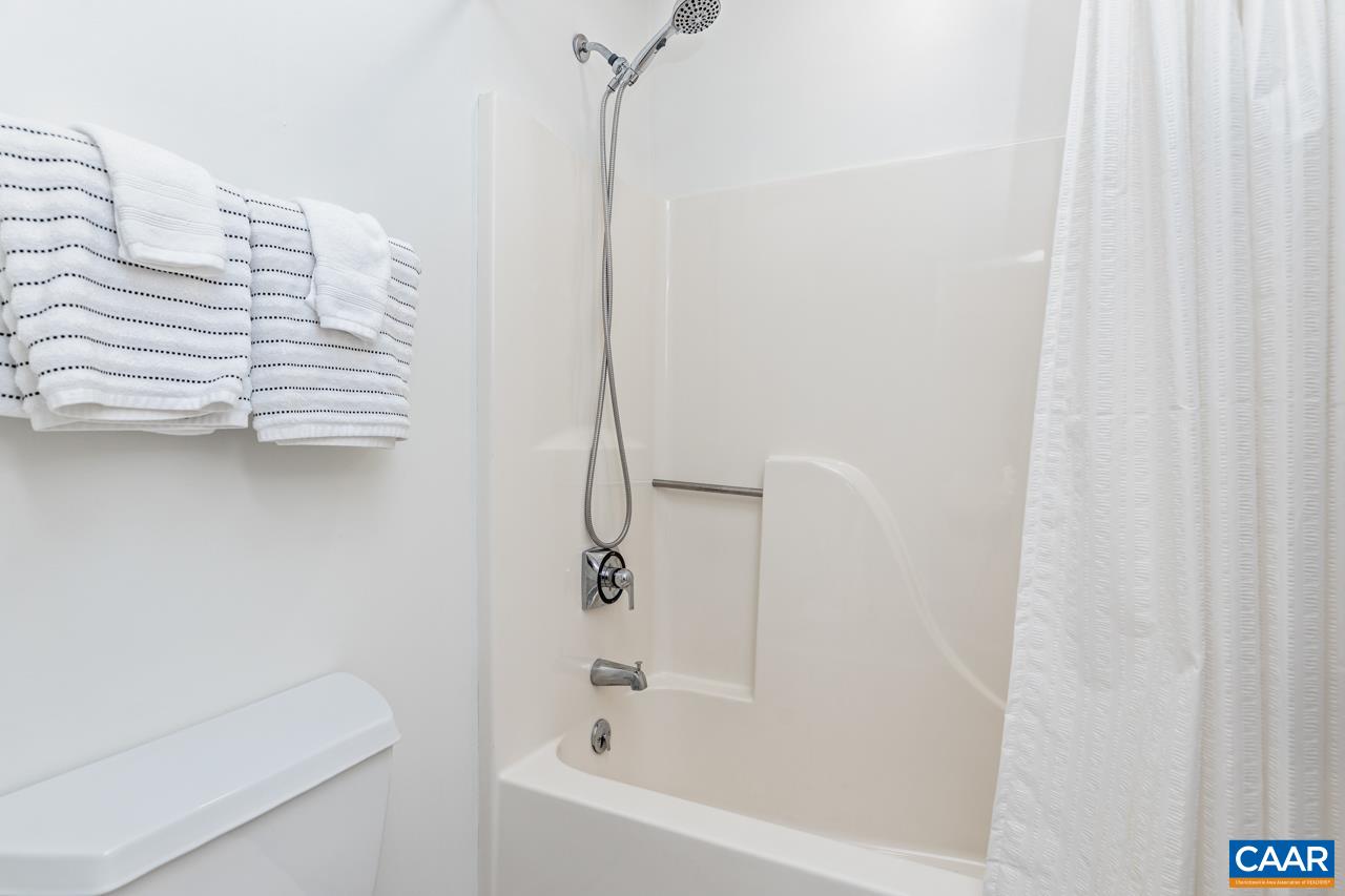 2016 Stone Rdg Wds Roseland, VA 22967 - Photo 27 of 32 a bathroom with a bathtub and a shower