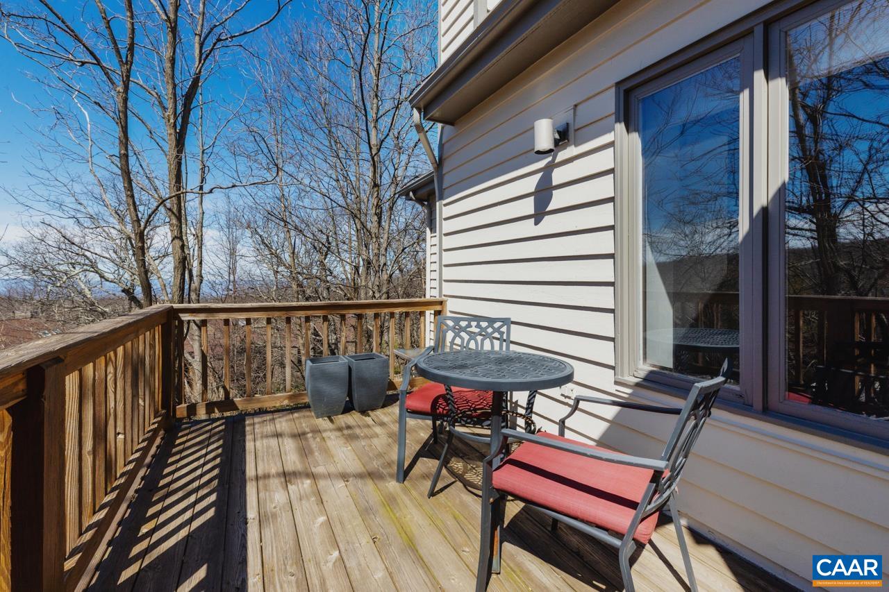 2016 Stone Rdg Wds Roseland, VA 22967 - Photo 30 of 32 a balcony with wooden floor table and chairs