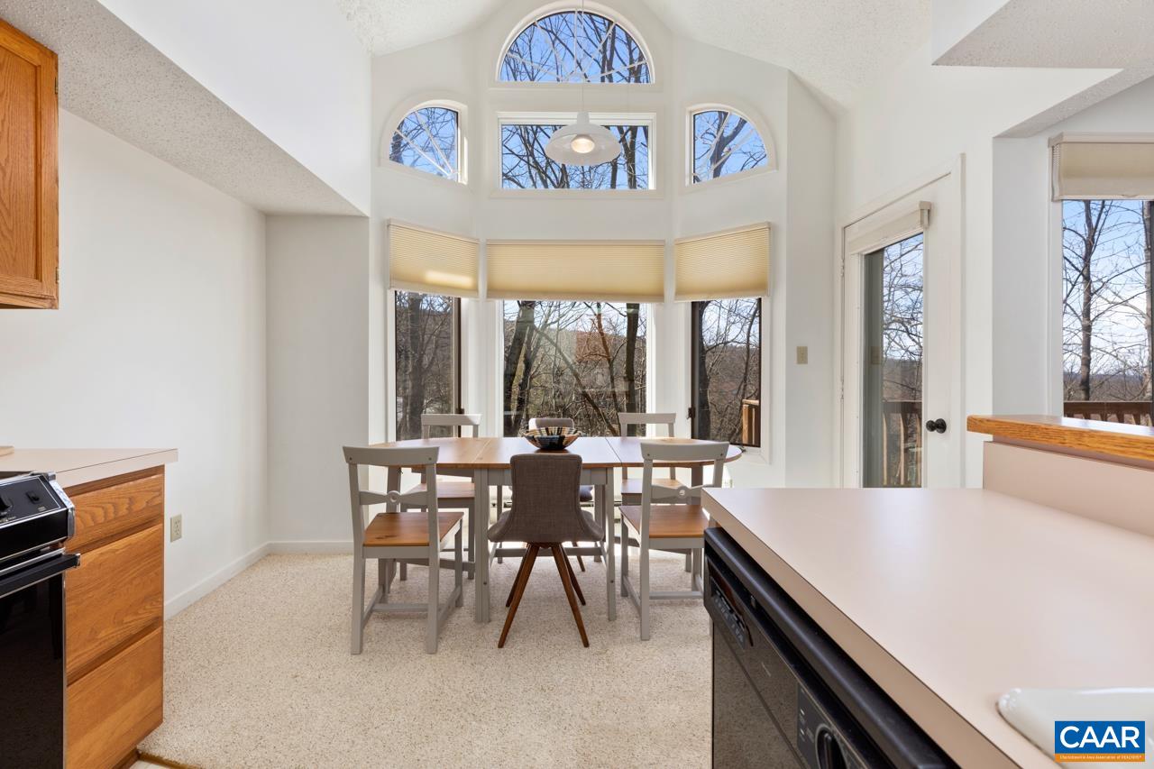 2016 Stone Rdg Wds Roseland, VA 22967 - Photo 10 of 32 a view of a dining room with furniture window and outside view