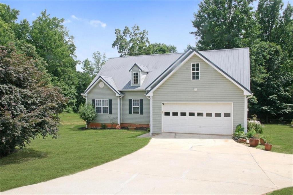 245 Melvin Phillips Road Jefferson, GA 30549 - Photo 1 of 1 a front view of a house with a yard