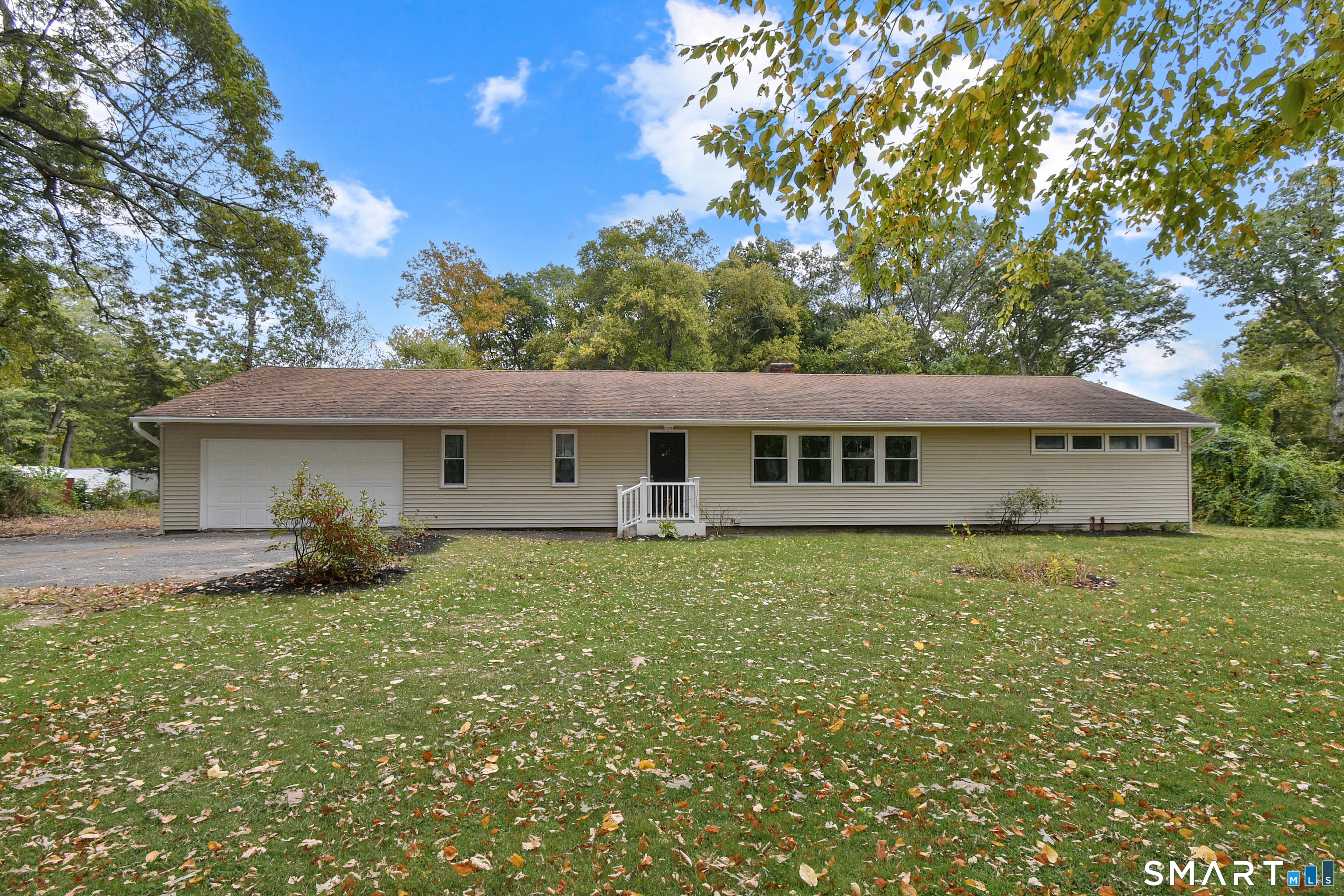 a view of house with yard