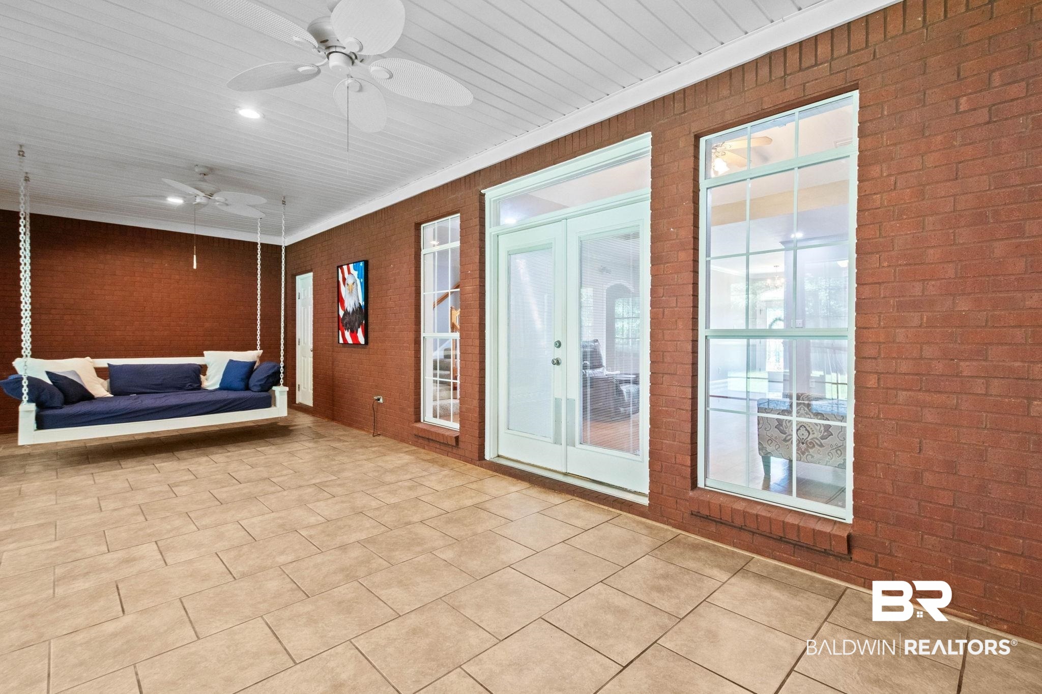 3176 Cedar Court Mobile, AL 36619 - Photo 26 of 33 Brick exterior covered patio featuring a plank ceiling, ceiling fans, recessed lighting, and tile flooring