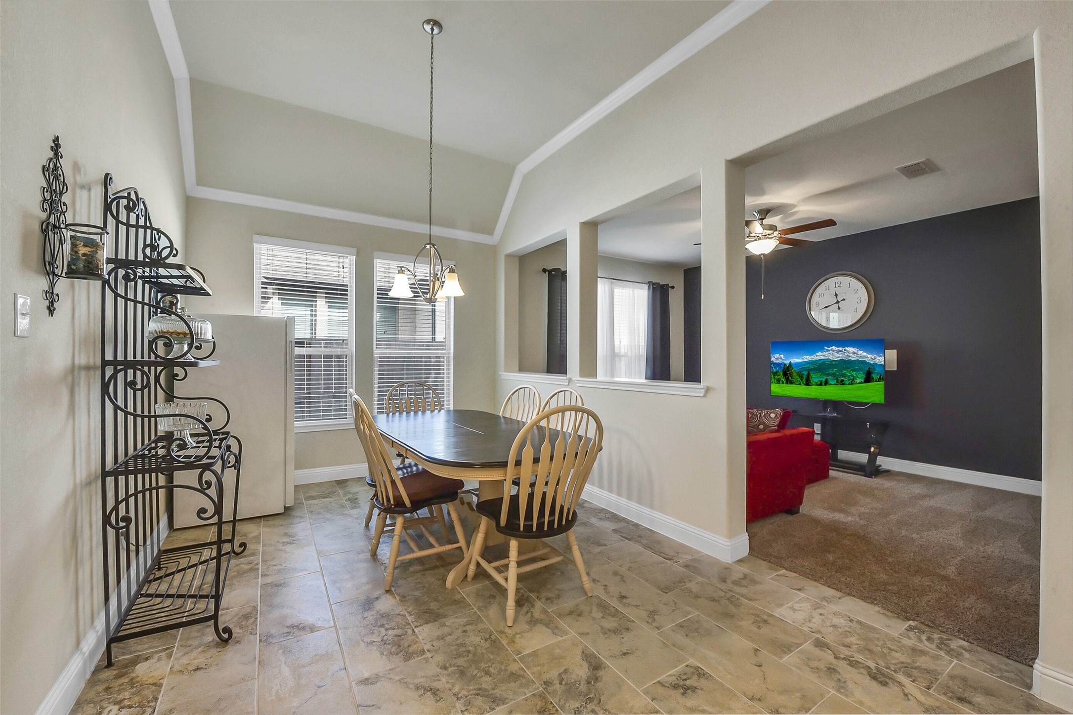 9519 Carson Lane Rosharon, TX 77583 - Photo 14 of 39 a dining room with furniture a chandelier and wooden floor