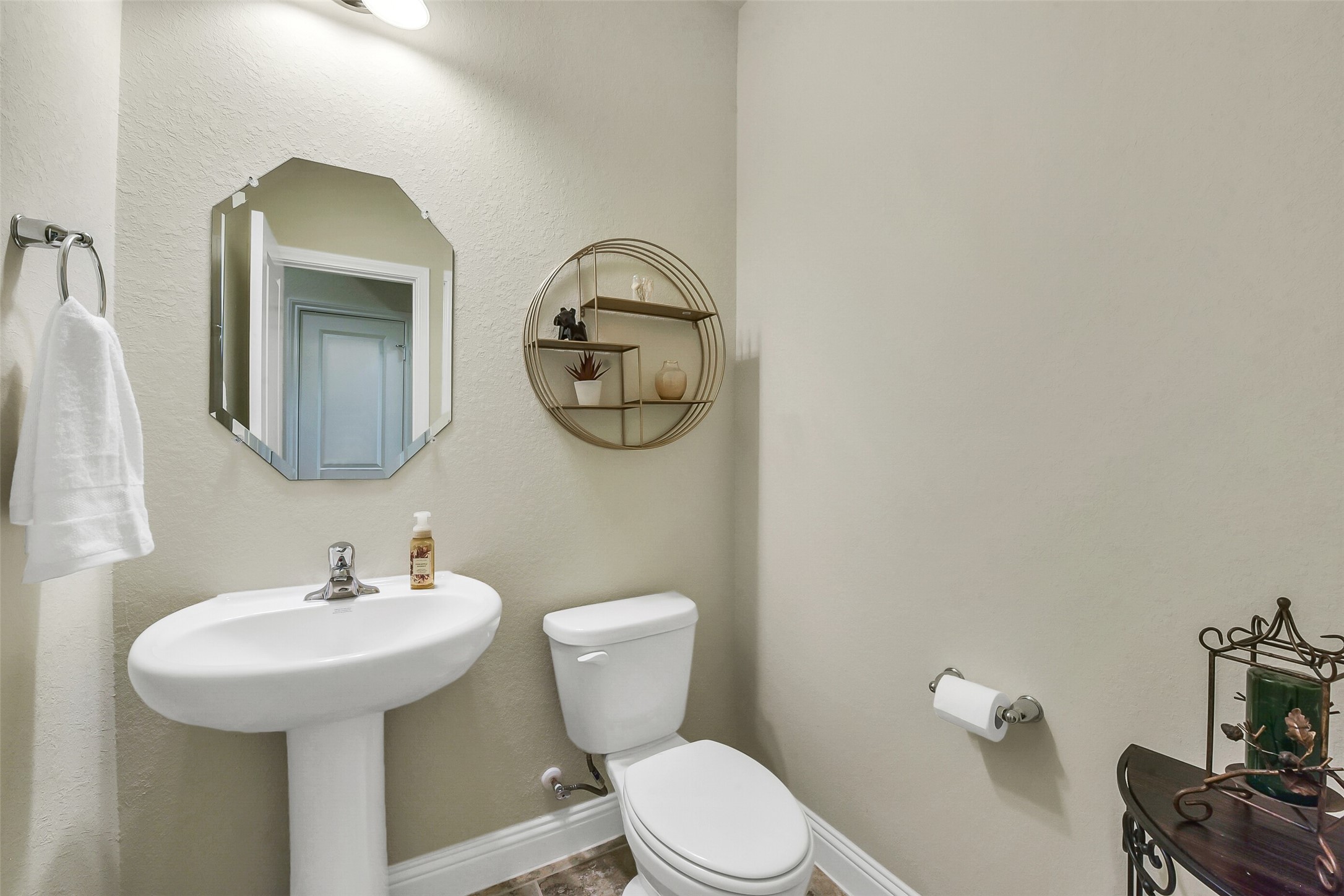 9519 Carson Lane Rosharon, TX 77583 - Photo 21 of 39 a bathroom with a toilet a sink and mirror