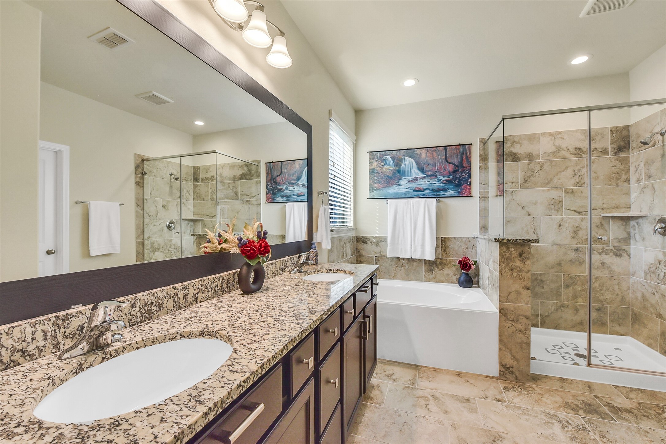 9519 Carson Lane Rosharon, TX 77583 - Photo 24 of 39 a bathroom with a granite countertop double vanity sink a mirror and a bathtub