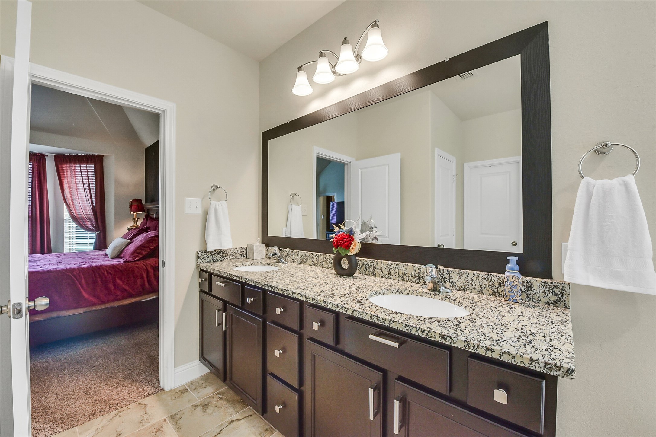 9519 Carson Lane Rosharon, TX 77583 - Photo 26 of 39 a bathroom with a granite countertop double vanity sink and a mirror