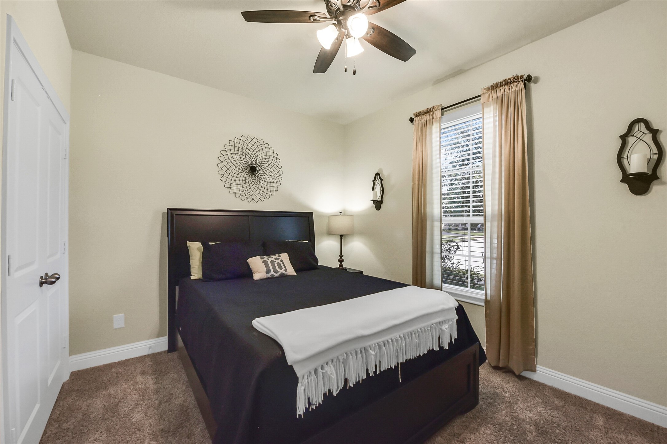 9519 Carson Lane Rosharon, TX 77583 - Photo 27 of 39 a bedroom with a bed and window