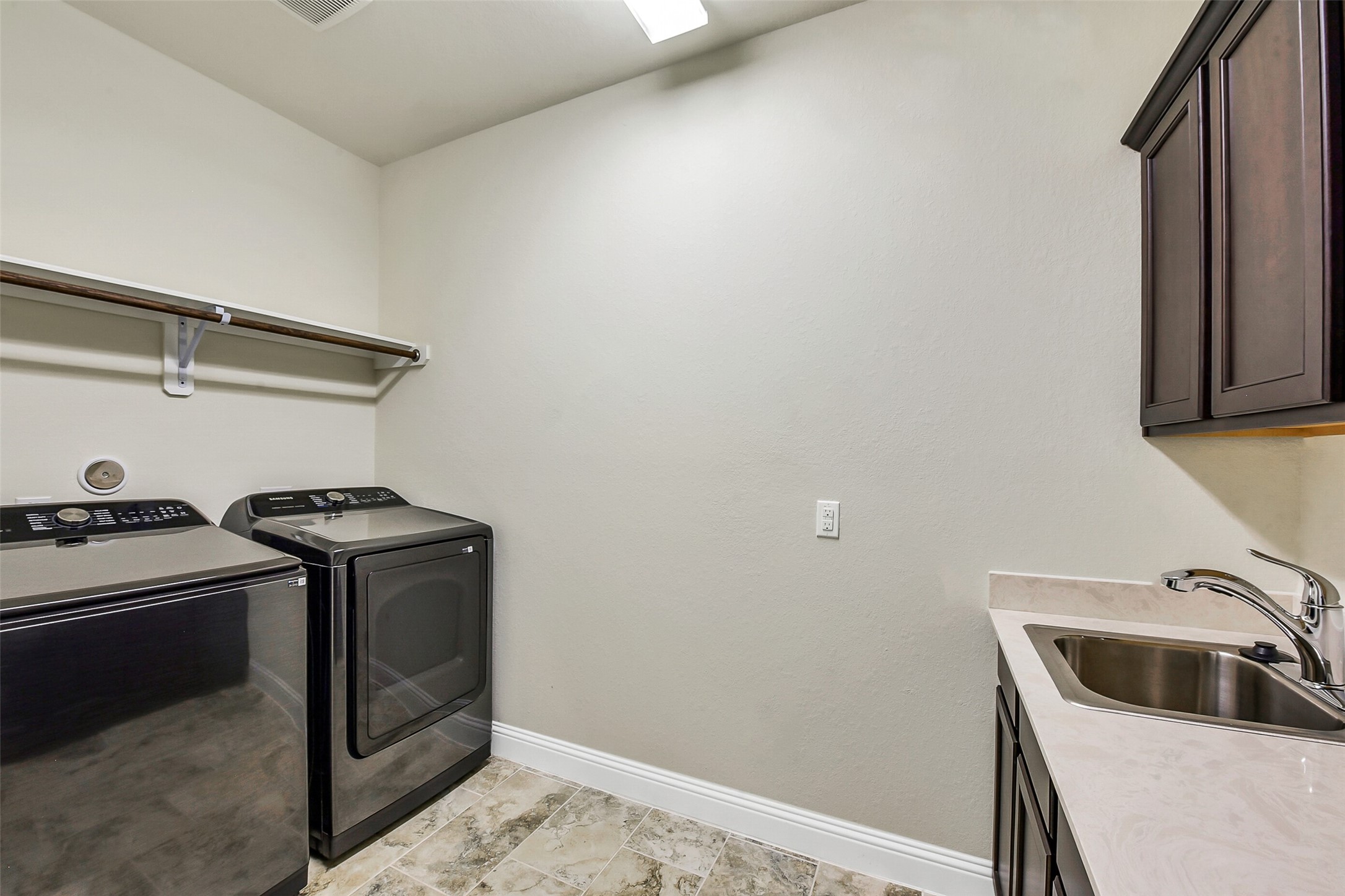 9519 Carson Lane Rosharon, TX 77583 - Photo 32 of 39 a kitchen with a stove and a sink
