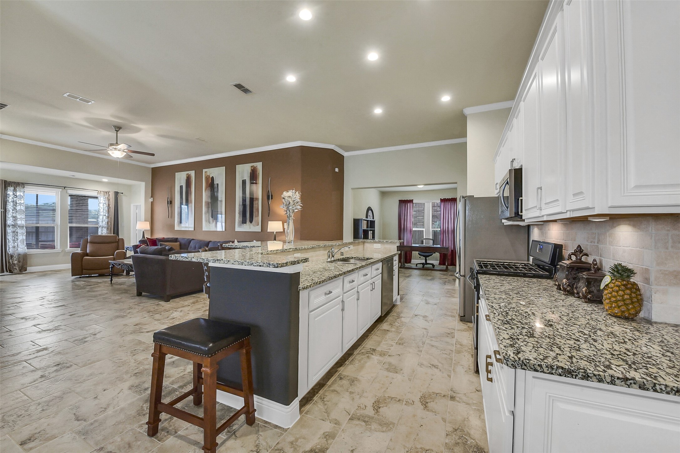 9519 Carson Lane Rosharon, TX 77583 - Photo 10 of 39 a large white kitchen with lots of counter space and chandelier