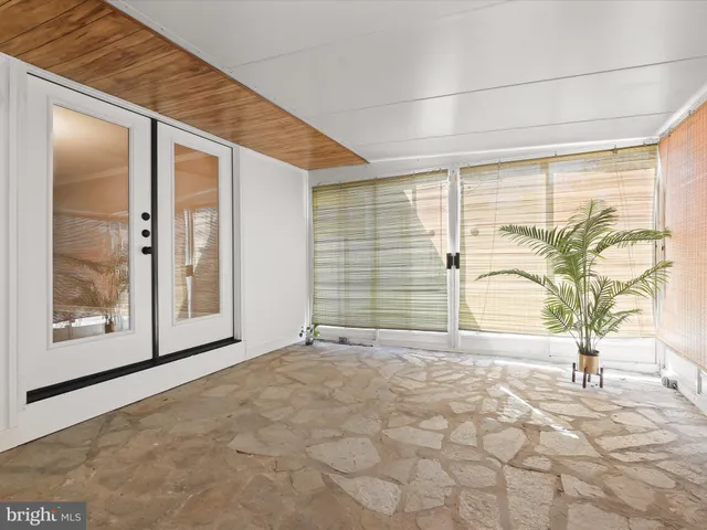 a view of potted plants in front of door