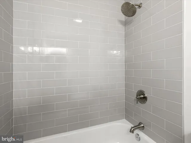 a bathroom with a sink toilet and mirror