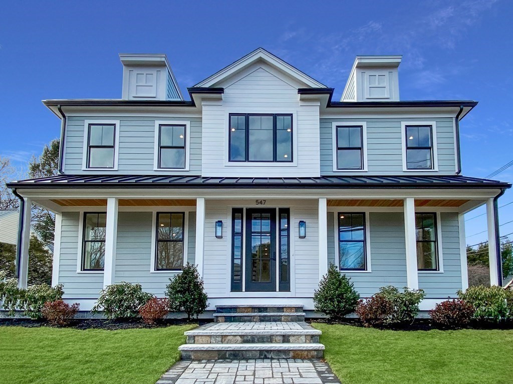 547 Webster Street Needham, MA 02494 - Photo 1 of 39 a front view of a house with a yard and trees