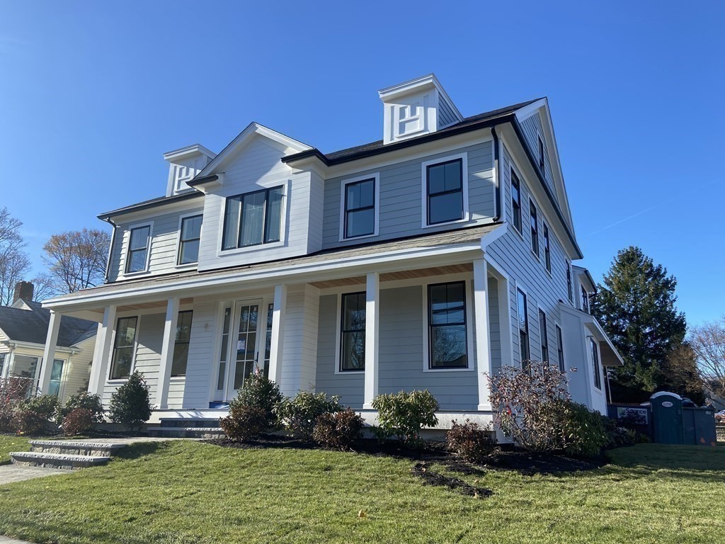547 Webster Street Needham, MA 02494 - Photo 2 of 39 a front view of a house with a yard