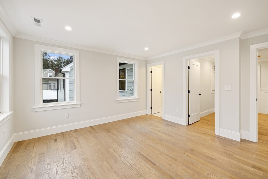 547 Webster Street Needham, MA 02494 - Photo 26 of 39 a view of an empty room with wooden floor and a window