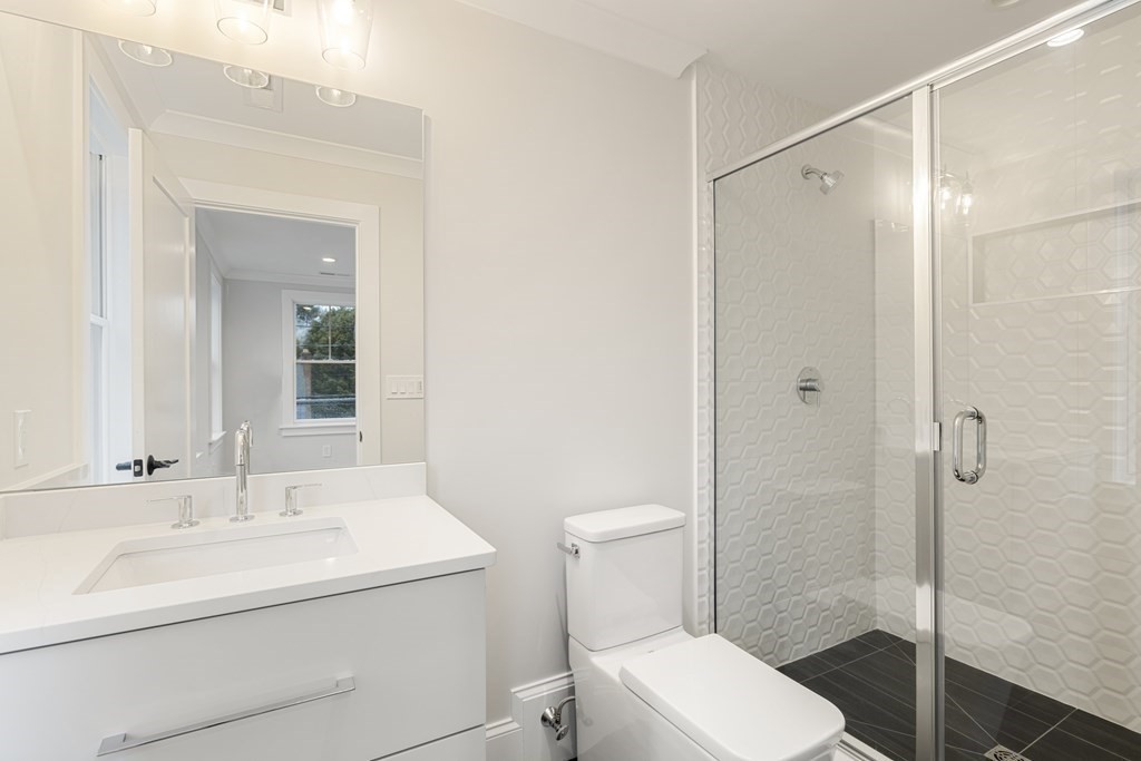 547 Webster Street Needham, MA 02494 - Photo 27 of 39 a bathroom with a sink toilet and shower