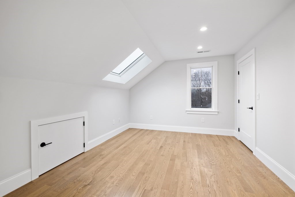 547 Webster Street Needham, MA 02494 - Photo 30 of 39 wooden floor in an empty room with a window