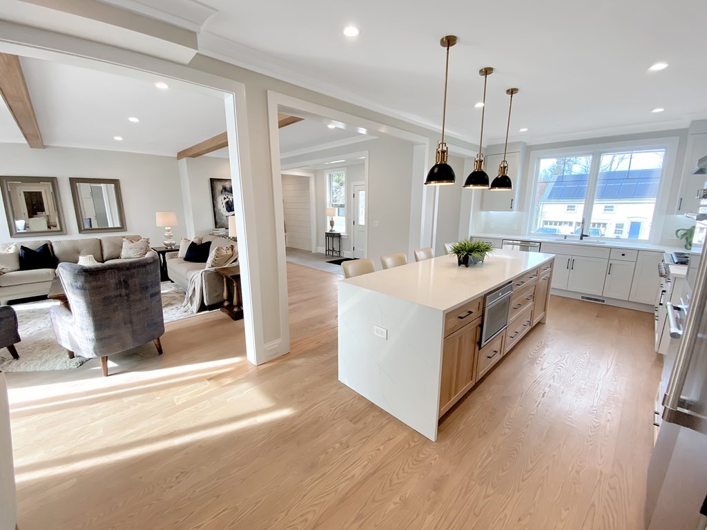 547 Webster Street Needham, MA 02494 - Photo 10 of 39 a large kitchen with stainless steel appliances kitchen island granite countertop a large counter top and sink