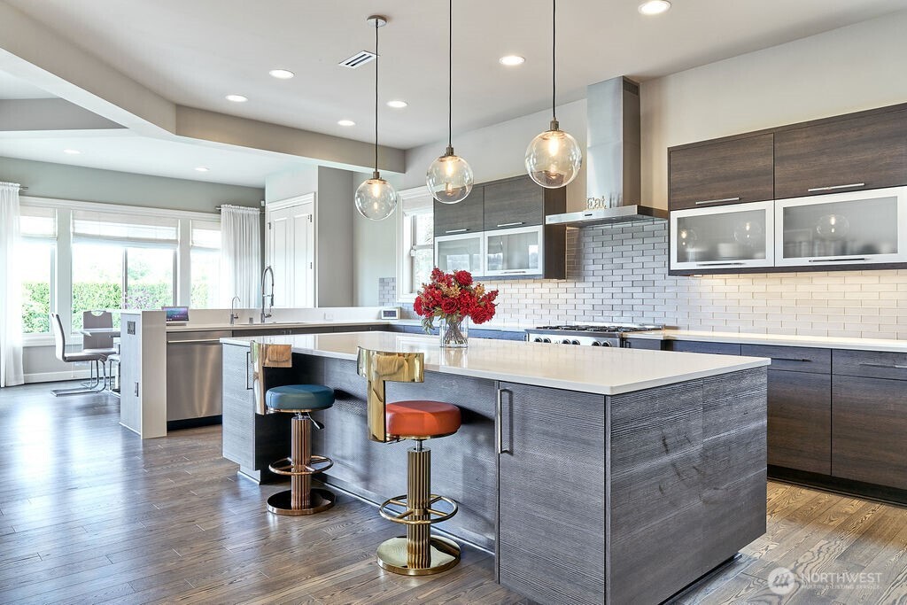3319 Burnett Avenue North Renton, WA 98056 - Photo 19 of 40 a kitchen with kitchen island a counter space a sink appliances and a counter top space