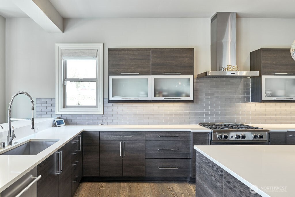 3319 Burnett Avenue North Renton, WA 98056 - Photo 21 of 40 a kitchen with stainless steel appliances a sink stove and cabinets