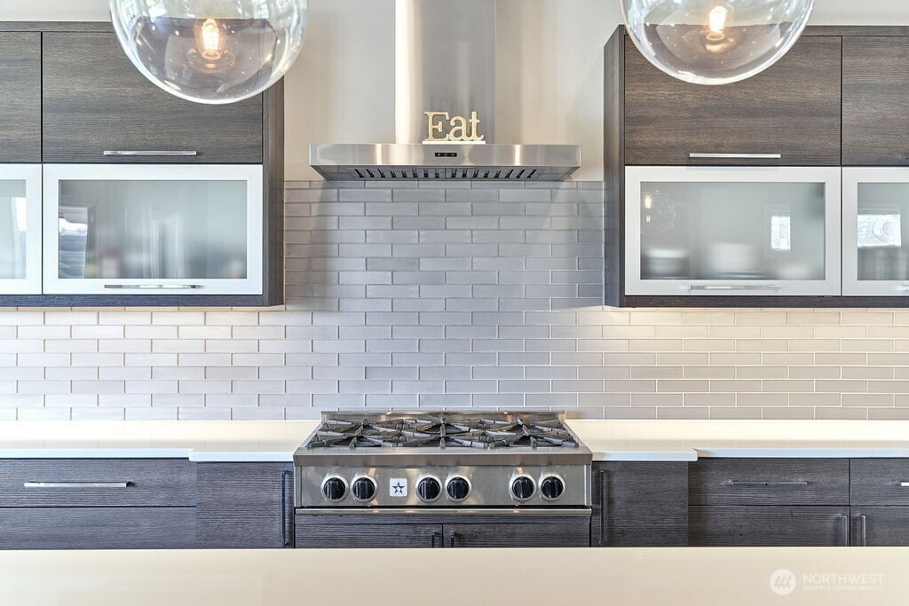 3319 Burnett Avenue North Renton, WA 98056 - Photo 23 of 40 a close view of a stove a sink and a mirror