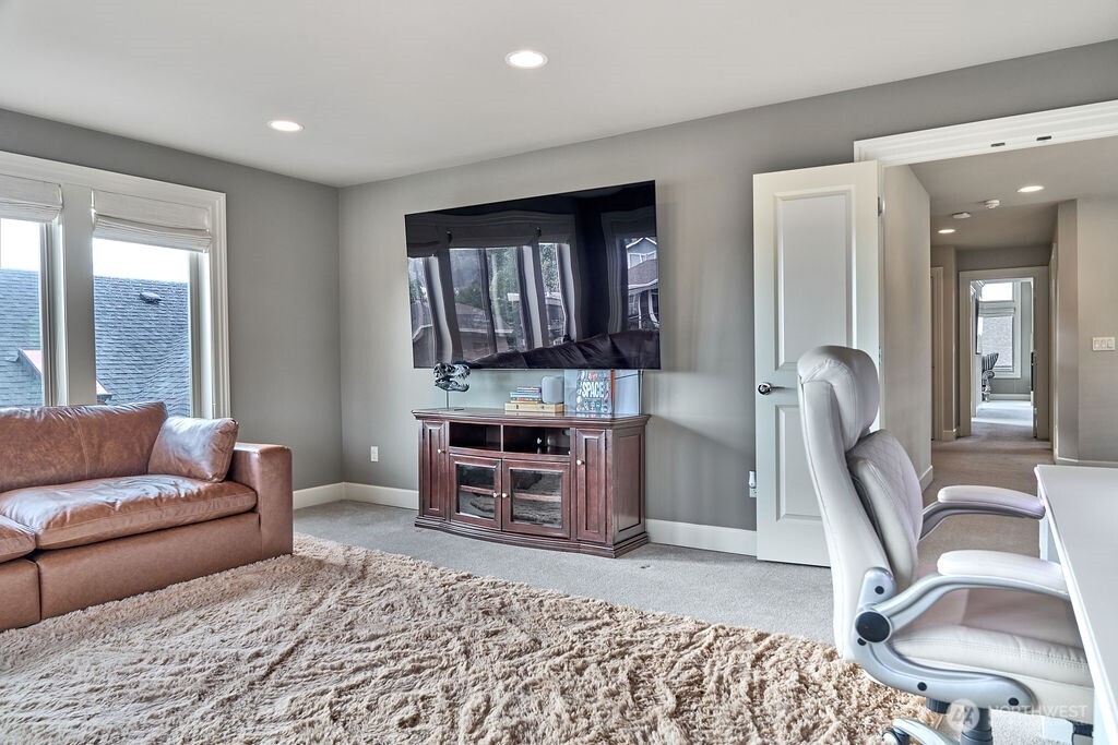 3319 Burnett Avenue North Renton, WA 98056 - Photo 29 of 40 a living room with furniture a flat screen tv and large windows