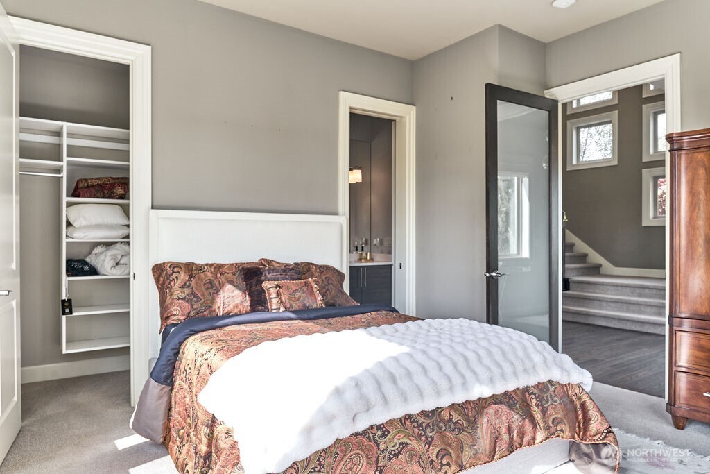 3319 Burnett Avenue North Renton, WA 98056 - Photo 37 of 40 a bedroom with a bed and walk in closet