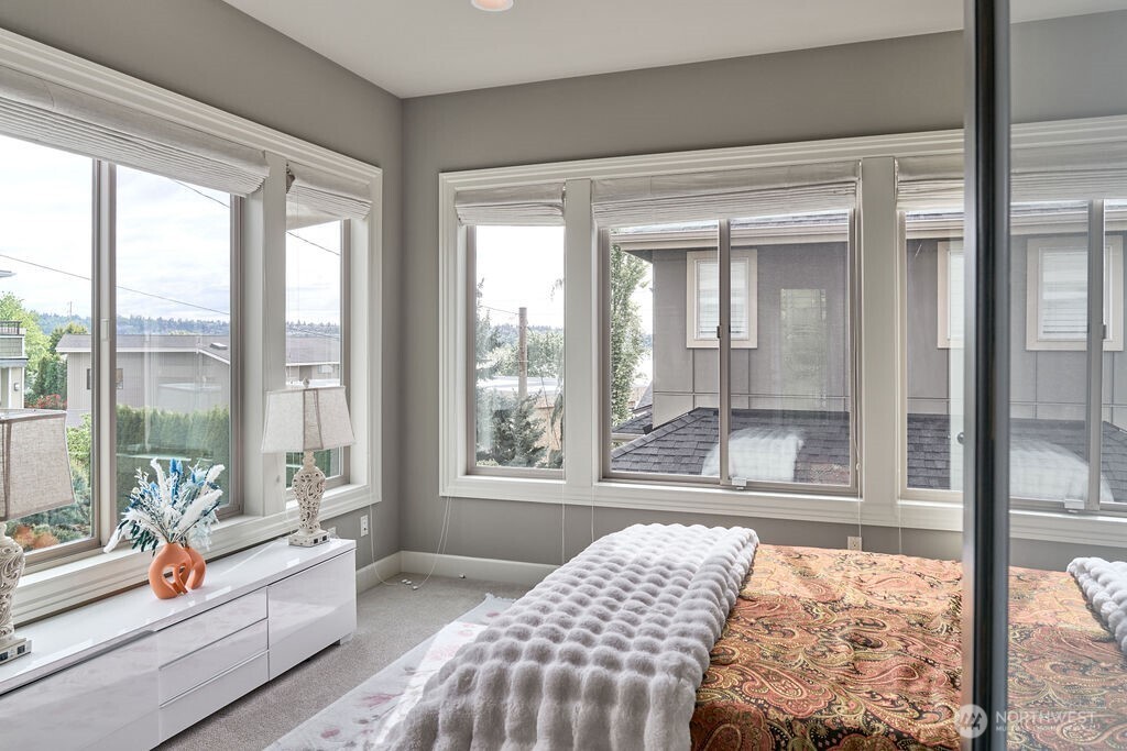 3319 Burnett Avenue North Renton, WA 98056 - Photo 38 of 40 a bedroom with furniture and large windows