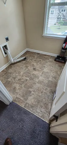 a view of a room with rack and a window